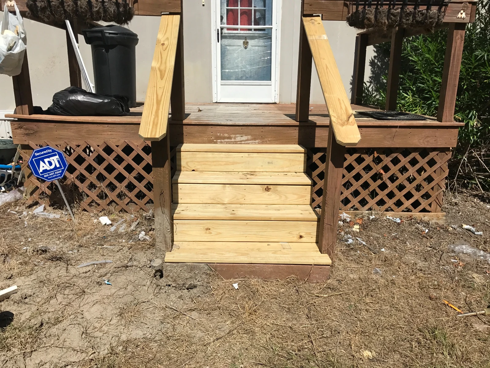 Rebuilt porch steps with pressure-treated lumber