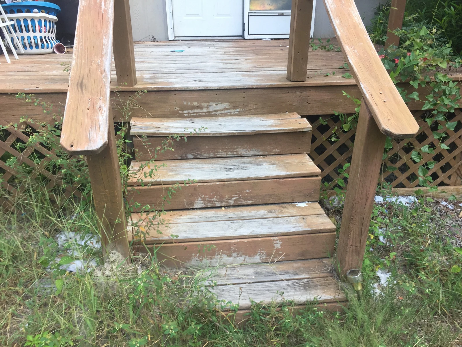 Weathered porch steps before repair